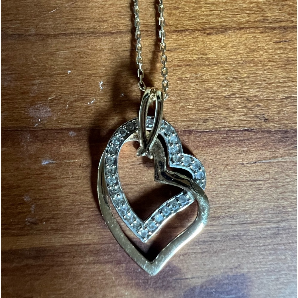 Gold and diamond hearts on 20 inch gold chain necklace.